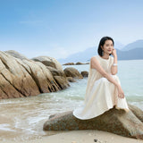 Elegant Ivory Pleated Midi Dress with Vertical Structure - Sophisticated Beige Attire for Women