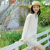 Elegant Beige Tencel-Linen V-Neck Vacation Blouse with Asymmetric Waist Tie - Fluid Silky Texture for Women